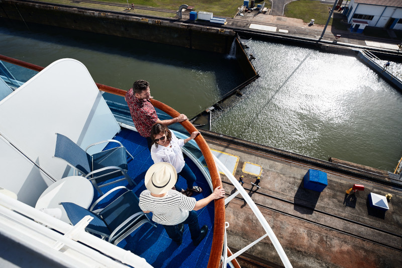 People viewing Panama Canal locks from cruise ship. Ship railing, canal transit, 5 star cruise.