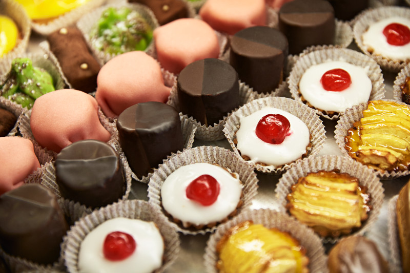 A delightful assortment of colourful sweets and pastries displayed in a charming shop in Aix-en-Provence, Marseilles.