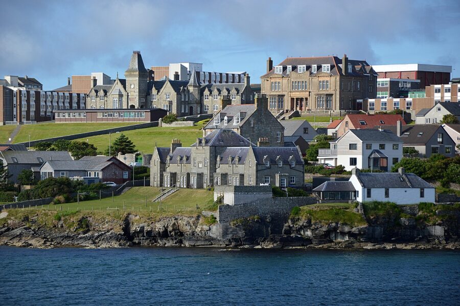 Lerwick, Shetland Islands, seen from the water during the Springtime Fjordland Cruise from Belfast. Harbour with colourful buildings and modern architecture.