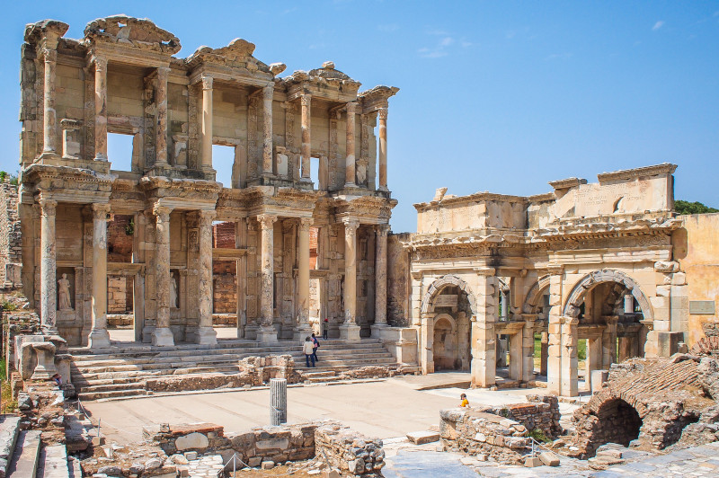 Tourists exploring the majestic ruins of the Library of Celsus, a highlight of any visit to Ephesus. Travel Escapes Cruises and Tours
