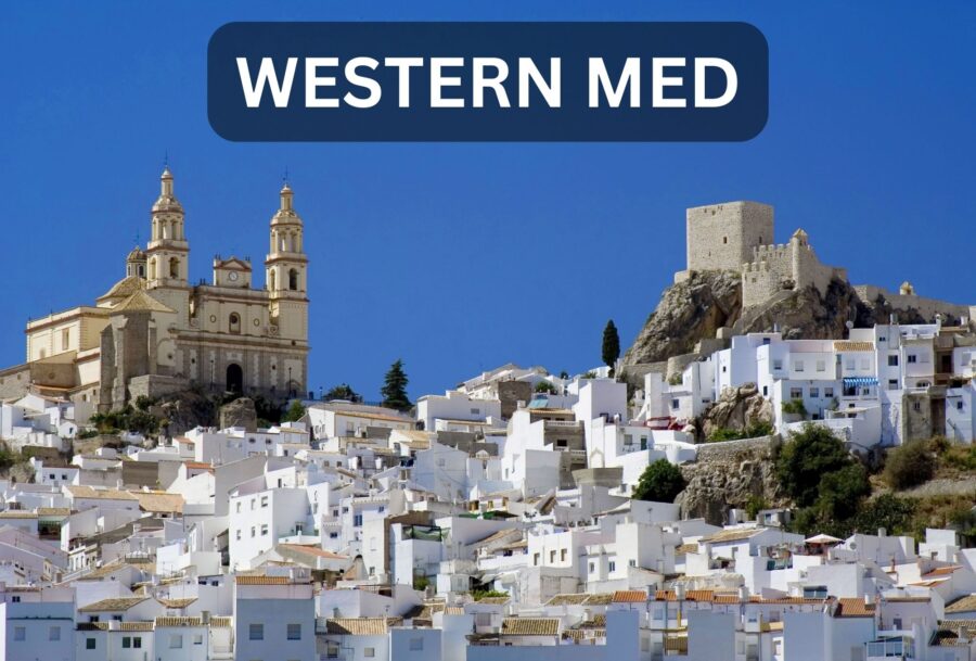 Cadiz with blue skies and church with buildings in the forefront