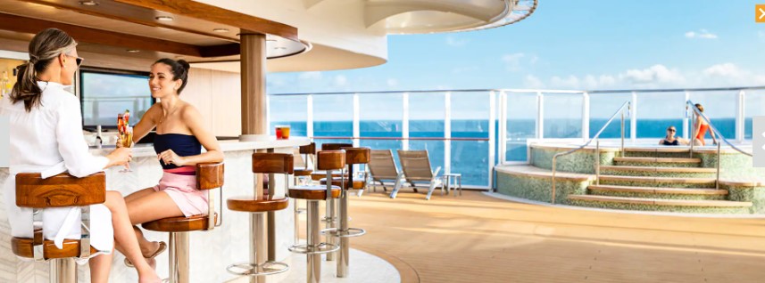 Poolside bar on the Norwegian Bliss cruise ship, offering refreshing drinks and ocean views for Irish passengers.