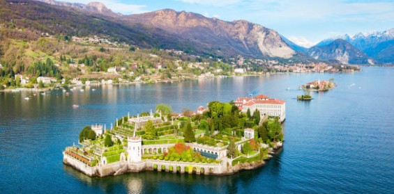 The beautiful Isola Bella on Lake Maggiore, Italy, with its stunning baroque palace and famous terraced gardens, with mountains in the background.