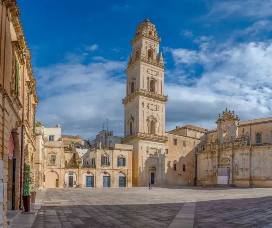 The ornate Baroque bell tower (Campanile) of Lecce Cathedral rising above the Piazza del Duomo in Lecce, Puglia, Italy.